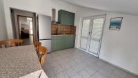 Kuchyň nebo kuchyňský kout v ubytování Anic Apartments Stanići