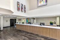 an empty lobby of a hospital with a reception counter at Anaheim Desert Inn & Suites in Anaheim
