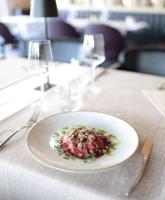 a plate of food sitting on a table at Boutique Hotel St Georgije in Banja Luka