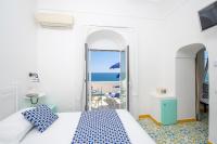 A bed or beds in a room at Hotel Costa Diva