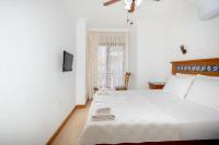 Postel nebo postele na pokoji v ubytování Datca Kilic Hotel