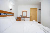 Postel nebo postele na pokoji v ubytování Datca Kilic Hotel