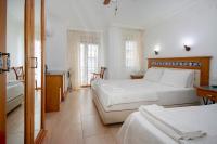 Postel nebo postele na pokoji v ubytování Datca Kilic Hotel