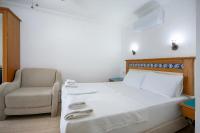 Postel nebo postele na pokoji v ubytování Datca Kilic Hotel