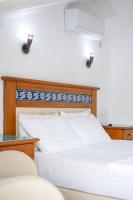 Postel nebo postele na pokoji v ubytování Datca Kilic Hotel
