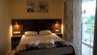 A bed or beds in a room at Apartments Palladium
