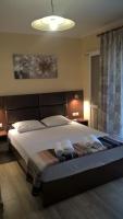 A bed or beds in a room at Apartments Palladium
