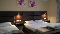 A bed or beds in a room at Apartments Palladium