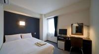 a.Suehiro Hotelにあるベッド