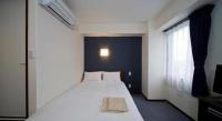 a.Suehiro Hotelにあるベッド