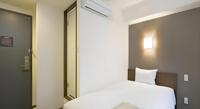 a.Suehiro Hotelにあるベッド