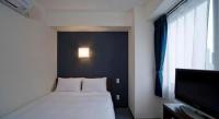 a.Suehiro Hotelにあるベッド