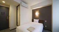 a.Suehiro Hotelにあるベッド