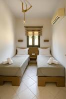 Posteľ alebo postele v izbe v ubytovaní Kefalonian Oneira Villas