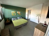 A bed or beds in a room at SOLUS B&B