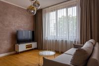 Televízia a/alebo spoločenská miestnosť v ubytovaní Rosso Aparthotel