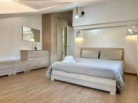 A bed or beds in a room at Alba & Tramonto