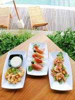 two plates of food sitting on a table at Devani Resort Sidemen in Sidemen