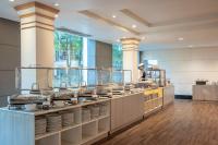 een keuken met een aanrecht met borden bij Tawa Ravadee Resort Prachinburi, a member of WorldHotels Distinctive in Si Maha Phot