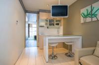 A television and/or entertainment centre at Ako Suite Hotel