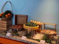 a display of fruits and vegetables on a counter at SOLAYAstay in Gò Ba Quần