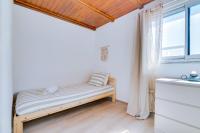 Postel nebo postele na pokoji v ubytování Casa Ramiro II Escapadinha na Ilha da Culatra