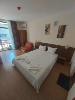 A bed or beds in a room at Guest House Skalite