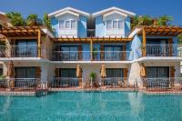 The swimming pool at or close to La Boutique Maya