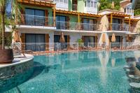 The swimming pool at or close to La Boutique Maya