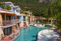 The swimming pool at or close to La Boutique Maya