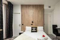 A bed or beds in a room at Apartamentos Day Madrid CHUECA Centro Gran Via Sol Malasaña