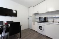 A kitchen or kitchenette at Apartamentos Day Madrid CHUECA Centro Gran Via Sol Malasaña