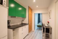 A kitchen or kitchenette at Apartamentos Day Madrid CHUECA Centro Gran Via Sol Malasaña