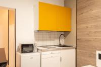 A kitchen or kitchenette at Apartamentos Day Madrid CHUECA Centro Gran Via Sol Malasaña