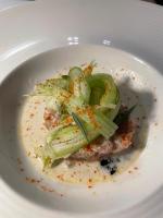 a plate of food with vegetables on a white plate at Amatì Design Green Hotel in Zola Predosa