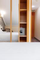 A bed or beds in a room at Hotel Ciudad Cangas de Onis