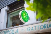 a green sign on the side of a building at Szerb Boutique Suites, by BQA in Budapest