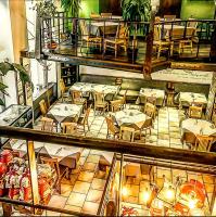 an overhead view of a restaurant with tables and chairs at Szerb Boutique Suites, by BQA in Budapest