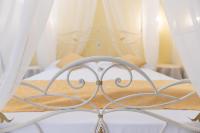 A bed or beds in a room at Locanda Fassa