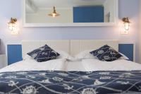 A bed or beds in a room at Locanda Fassa