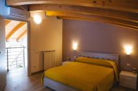 A bed or beds in a room at Casa Vacanze Robinson