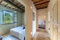 A bed or beds in a room at L'Oliveta 6, Emma Villas