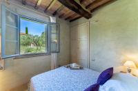 A bed or beds in a room at L'Oliveta 6, Emma Villas