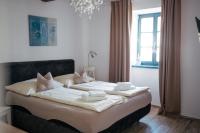 Postel nebo postele na pokoji v ubytování Mikulov Apartmány MAGISTR
