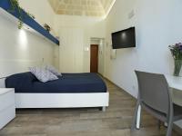 Televízia a/alebo spoločenská miestnosť v ubytovaní Sea View Teti Rooms & Apts