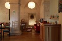 a restaurant with a bar and chairs in a room at San Agustin Posada del Monasterio in Arequipa