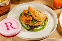 a sandwich on a white plate on a table at Renaissance Dallas Hotel in Dallas