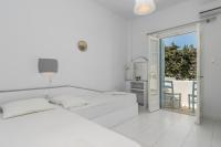 Posteľ alebo postele v izbe v ubytovaní Apollon Rooms