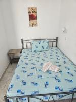 A bed or beds in a room at Villa Giannis 2