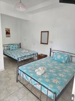 A bed or beds in a room at Villa Giannis 2